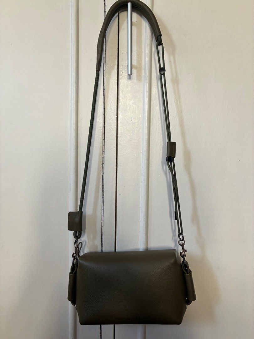 Absolute_Clay Model III Sling Bag (Category: Luxury Bags & Wallets) located in Taguig. Submitted by juju428 (Listing ID 1400205957, Image 2). Description: Absolute_Clay Sling Bag (Topologie alternative) - Bought in Chatuchak Market, Bangkok last April - olive greeb Cowhide leather with suede interior, leather and parachord adjustable strap - Used only twice - Dimensions: L - 9.5 inches H - 4.5 inches W - 3 inches .