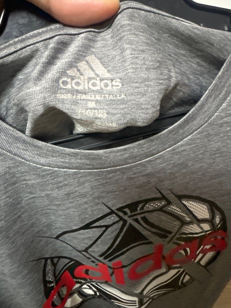 Adidas Soccer Graphic Tee - M (10/12) (Category: Shirts) located in Manila. Submitted by dadandadan (Listing ID 1400334977, Image 1). Description: - Adidas t-shirt with soccer ball graphic - Size: M (10/12) - Features Adidas logo - Made of soft, breathable material - Crew neck and short sleeves - Ideal for sports or casual wear.