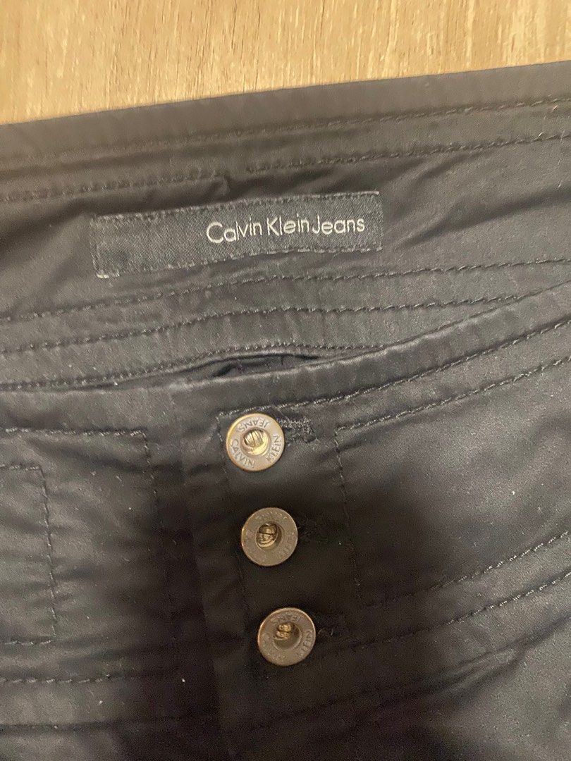 Calvin Klein Jeans Black Mini Skirt (Category: Skirts) located in Mandaluyong City. Submitted by declutts (Listing ID 1400208947, Image 3). Description: used once only W 28-30 L 14 No flaws Pm for ww Nego!.