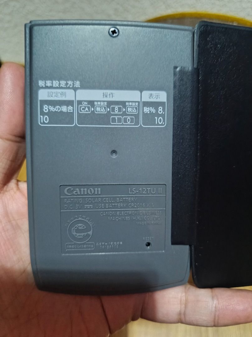 CANON LS-12TU II CALCULATOR (Category: Stationery & School Supplies) located in Makati City. Submitted by nyxhemera26 (Listing ID 1400337140, Image 3). Description: CANON LS-12TU II CALCULATOR - 300 • WORKING. LIKE NEW The product in the image is a Canon LS-12TU II calculator. It is a 12-digit handheld calculator with a soft wallet cover. Tax Function: It has tax calculation functions, including "tax included" (税込) and "tax excluded" (税抜) buttons