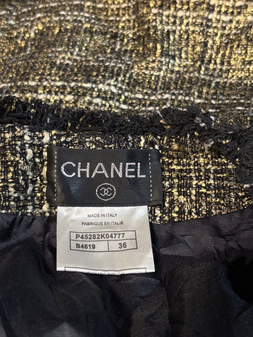 Chanel Metallic Gold Tweed Blazer Jacket (Category: Luxury Apparel) located in Cebu City. Submitted by stylingtrends.coll (Listing ID 1400222661, Image 2). Description: - Authentic Chanel tweed jacket - Classic design, single breasted - Black trim and two front pockets - Made in Italy - Black interior lining - Woven tweed in brown, black, and gold Size: FR 36, XS.