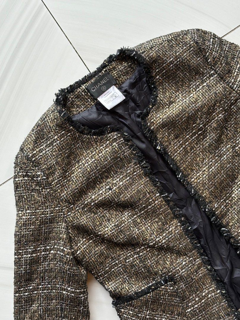 Chanel Metallic Gold Tweed Blazer Jacket (Category: Luxury Apparel) located in Cebu City. Submitted by stylingtrends.coll (Listing ID 1400222661, Image 3). Description: - Authentic Chanel tweed jacket - Classic design, single breasted - Black trim and two front pockets - Made in Italy - Black interior lining - Woven tweed in brown, black, and gold Size: FR 36, XS.