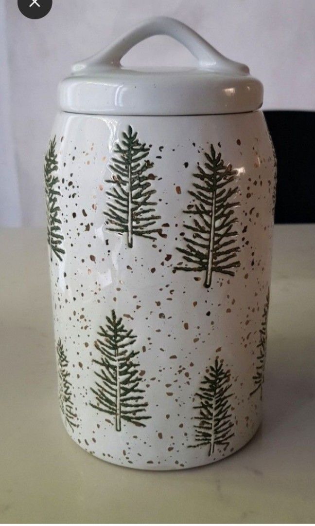 Classic Christmas Cookie Jar Pine trees by Potter's Studio (Category: Vases & Decorative Bowls) located in Quezon City. Submitted by happycheeeks (Listing ID 1400229169, Image 1). Description: just displayed good as new thick and heavy with rubber stopper 9 inches tall 5 inches diameter only for MM buyers last price.