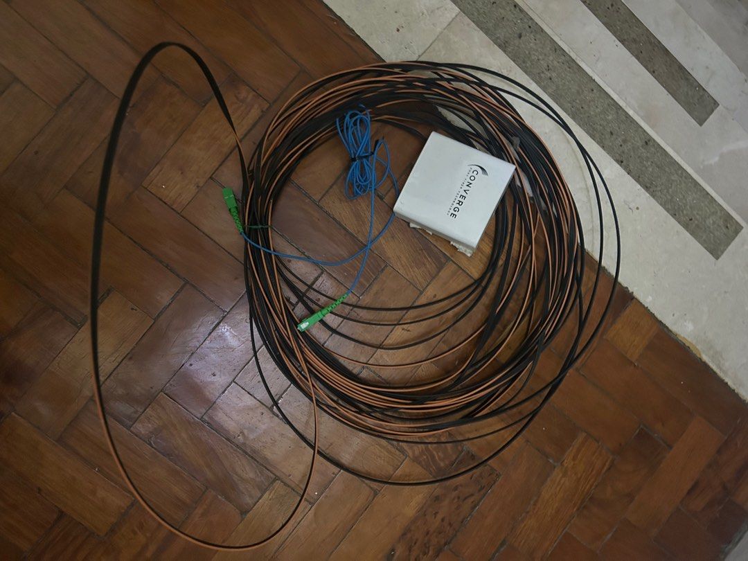 Converge Fiber Optic Cable (Category: Networking) located in Makati City. Submitted by luckyfinds77 (Listing ID 1400384106, Image 1). Description: - Fiber optic cable and Converge box included. - Comes with black, orange, and blue cables. - White Converge box. - Cables have green connectors. - Ideal for internet connection..