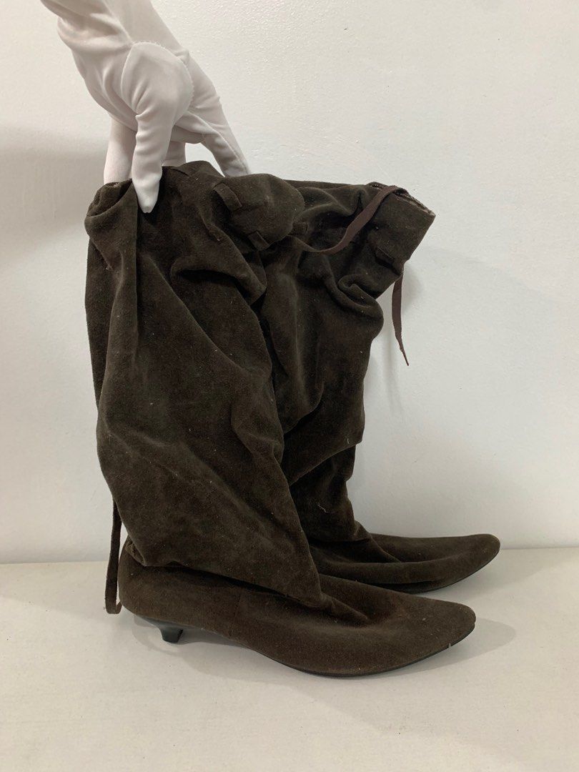 Dark brown heeled suede boots (Category: Boots) located in Abucay. Submitted by byppishh__ (Listing ID 1400340457, Image 1). Description: Preloved boots. Used once for cosplay. Issue: - heel cap (right shoe) - hole on the back (right shoe). not obvious since lukot yung design ng boots. .