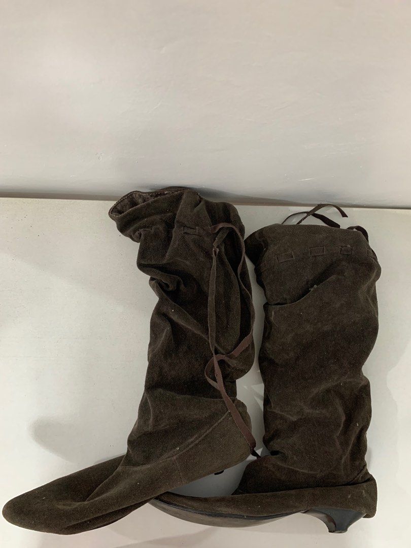 Dark brown heeled suede boots (Category: Boots) located in Abucay. Submitted by byppishh__ (Listing ID 1400340457, Image 2). Description: Preloved boots. Used once for cosplay. Issue: - heel cap (right shoe) - hole on the back (right shoe). not obvious since lukot yung design ng boots. .