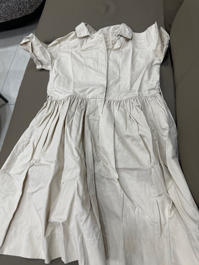 Gingersnaps Beige Dress Size 8 (Category: Babies & Kids Fashion) located in Quezon City. Submitted by sofia0228 (Listing ID 1400385603, Image 1). Description: - Gingersnaps beige dress - Size 8 - Collared neckline - Short sleeves - Pleated skirt - Button-up front - Lightweight fabric - Neutral color, versatile for different occasions.