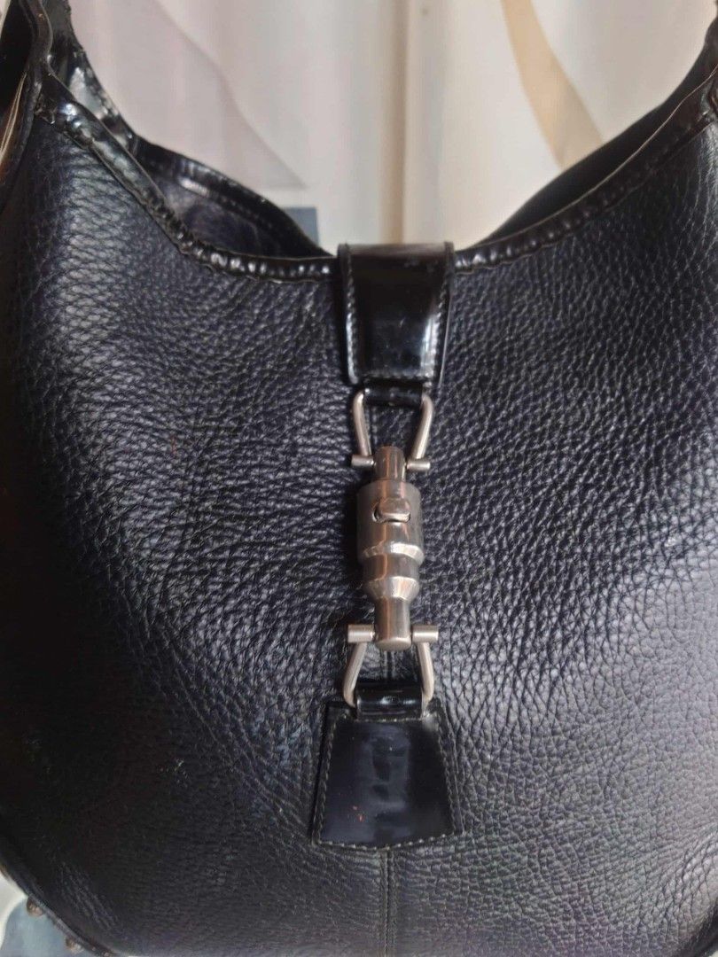 Jackie Black Leather Shoulder Bag (Category: Shoulder Bags) located in Caloocan City. Submitted by thon0806 (Listing ID 1400264847, Image 3). Description: its a vintage bag some creases on patent leather sign of used only superfacial cracks sa strap not noticeable genuine leather good quality .
