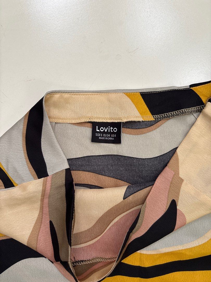 Lovito Abstract Print Mini Skirt (Category: Skirts) located in Rodriguez. Submitted by alekshivers (Listing ID 1400267750, Image 2). Description: Lovito mini skirt with an abstract print. Features a unique design with a mix of colors. The waist measures 13.5 inches or 27 cm, and the length is 16.5 inches. Made in China. Size is EU 36/ US 4..