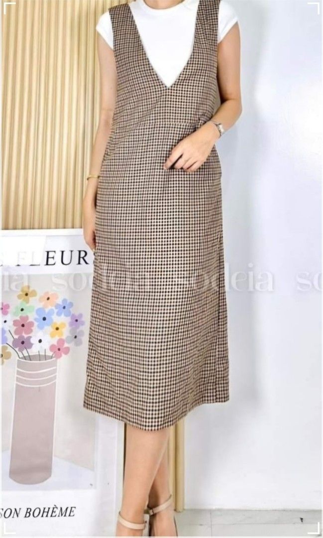 (M) Plaid V-Neck Dress (Category: Dresses) located in Pasay City. Submitted by reccaaaa (Listing ID 1400261506, Image 1). Description: Size: Medium Bust: up to 32 inches Width: 16 inches Overall Length: 42 inches Condition: 10/10 Other Details: • With working zipper on side • With 2 working side pockets • Good as new • Thick cotton fabric • Height reference (5'4) • Inner top not included RFS: Does not fit Location: Pasay No return, no exhange.