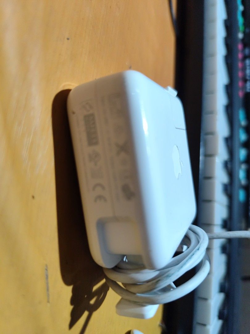 Macbook adaptor (Category: Laptops & Notebooks) located in Davao. Submitted by violentino74125 (Listing ID 1400380216, Image 2). Description: - Original Apple Macbook adaptor - Classic white design - Meetups available in Davao City.