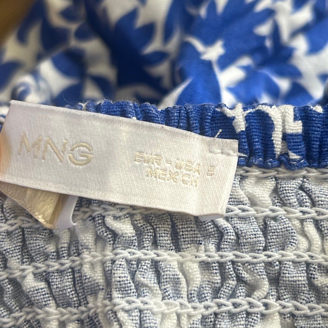 Mango Floral Print Crop Top with Tie (Category: Sleeveless) located in Quezon City. Submitted by misakiee (Listing ID 1400305293, Image 3). Description: - Blue and white floral print - Adjustable spaghetti straps - Tie detail at waist - Flattering silhouette - Great for summer - Versatile style.