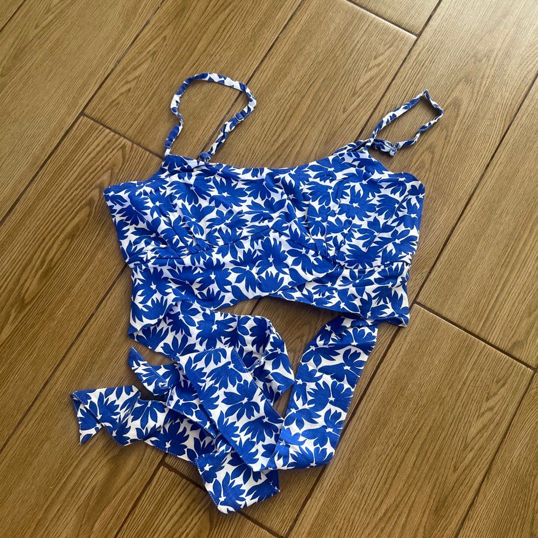 Mango Floral Print Crop Top with Tie (Category: Sleeveless) located in Quezon City. Submitted by misakiee (Listing ID 1400305293, Image 1). Description: - Blue and white floral print - Adjustable spaghetti straps - Tie detail at waist - Flattering silhouette - Great for summer - Versatile style.