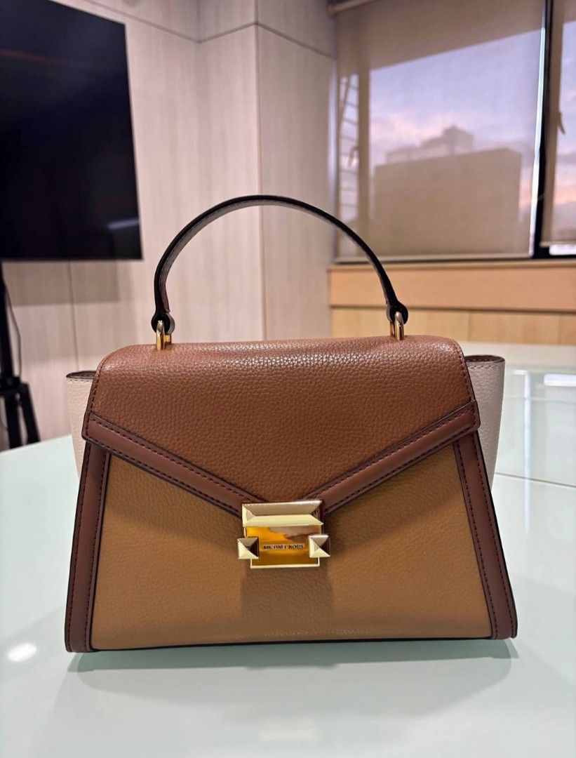 Michael Kors Whitney Top Handle Satchel (Category: Luxury Bags & Wallets) located in Caloocan City. Submitted by anythingprelovedd (Listing ID 1400234319, Image 1). Description: Original Color: Deer Multi Pre-loved, in pristine condition Detachable sling strap Magnetic snap closure Pebbled leather, gold hardware With poly plastic Payment first basis, same day ship once payment is settled via gcash..