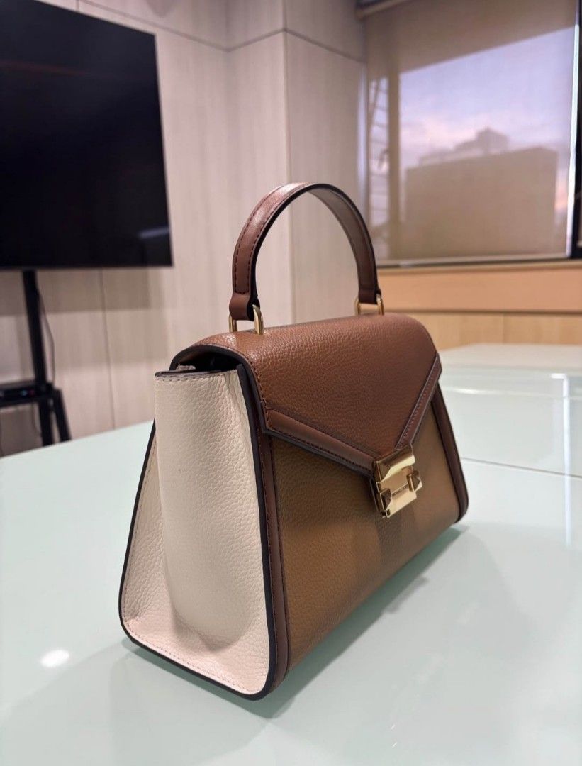 Michael Kors Whitney Top Handle Satchel (Category: Luxury Bags & Wallets) located in Caloocan City. Submitted by anythingprelovedd (Listing ID 1400234319, Image 2). Description: Original Color: Deer Multi Pre-loved, in pristine condition Detachable sling strap Magnetic snap closure Pebbled leather, gold hardware With poly plastic Payment first basis, same day ship once payment is settled via gcash..