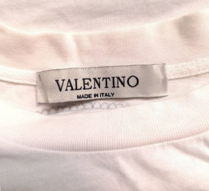 Valentino T-shirt (Category: Luxury Apparel) located in Baguio. Submitted by cc1516 (Listing ID 1396011986, Image 3). Description: - Valentino T-shirt - Red Valentino logo on the front - Small design on the back - Size: S/M - Made in Italy - Includes care instructions (see tag).