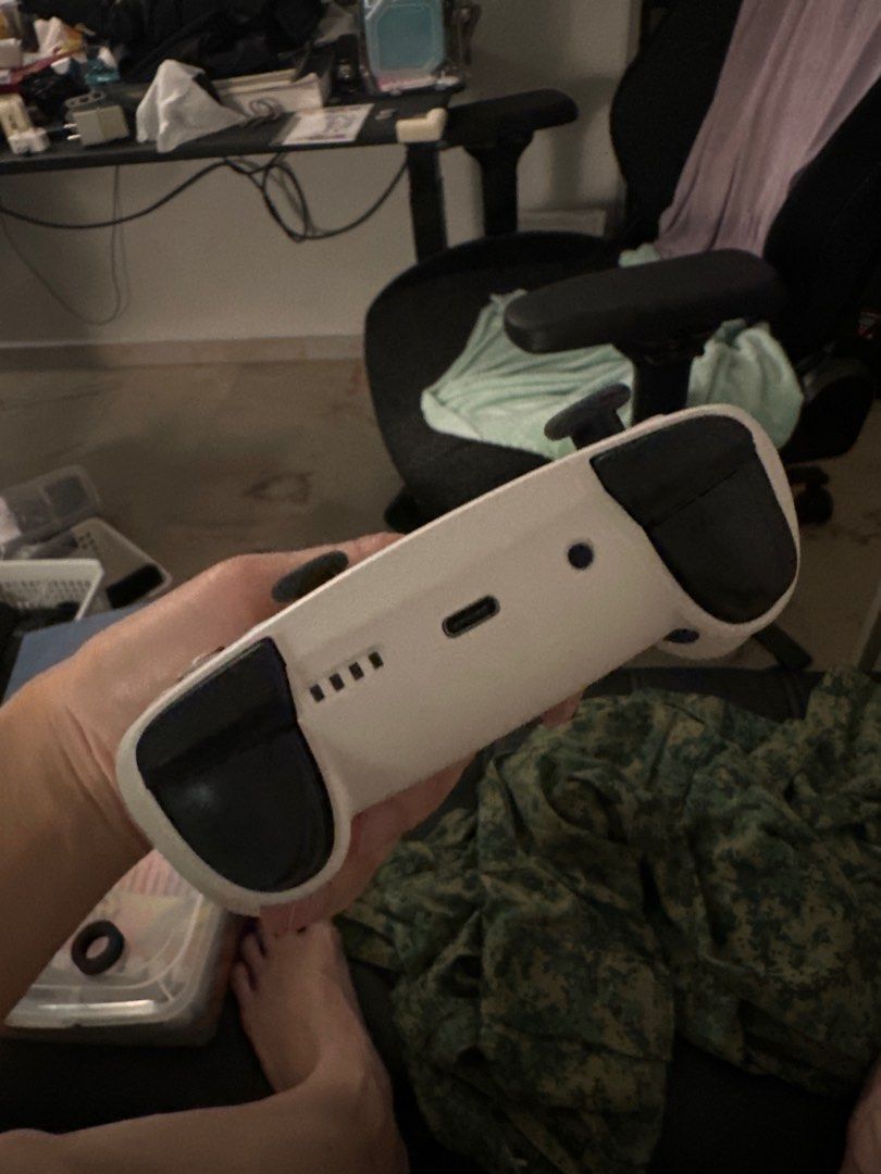 Wireless Game Controller - White (Category: Controllers) located in Singapore. Submitted by rikkochanzxc (Listing ID 1400375413, Image 2). Description: - Wireless game controller - Sleek white design - Illuminated buttons and thumbsticks - Button colors: Green, Red, Blue, Yellow - USB-C charging port - Perfect for gaming at home or on the go.