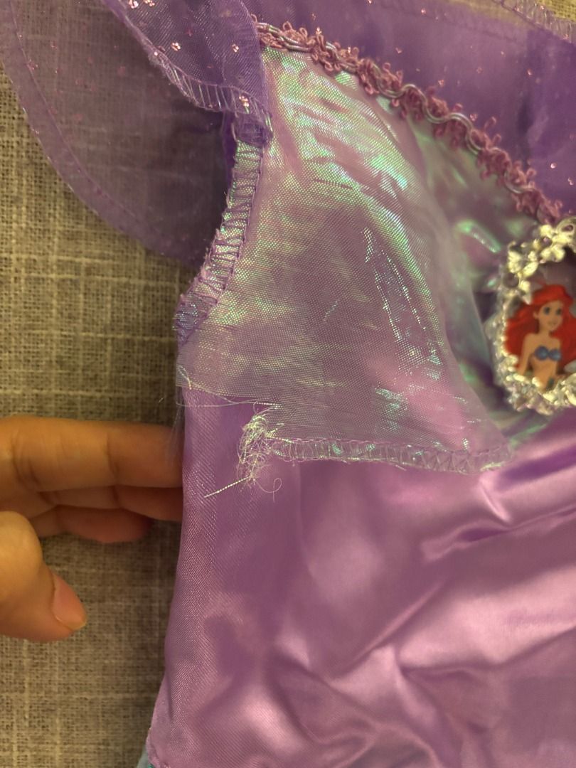 Ariel Mermaid Costume (Category: Babies & Kids Fashion) located in Muntinlupa City. Submitted by trish987 (Listing ID 1400437542, Image 2). Description: Beautiful Ariel mermaid costume - Purple and teal design - Sparkly tail - Jewel detail on top - Ruffled neckline and sleeves - Child's size - Minor tear on the fabric pls see photo Purchased for p2500 at Disney store Selling for p500 Makati.