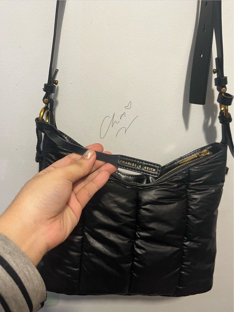 Charles & Keith Padded Shoulder Bag (Category: Shoulder Bags) located in Cainta. Submitted by chaching_corner (Listing ID 1400548093, Image 2). Description: ORIGINAL Charles & Keith Black Duo Quilted Shoulder Bag * good condition * 1 main compartment and 1 zipper closure compartment * Zipper closure * issue: strap lock sa magkabilang gilid ay natanggal na pero nakakabit pa rin siya sa hardware and useable pa as shoulder bag * rfs: not using anymo