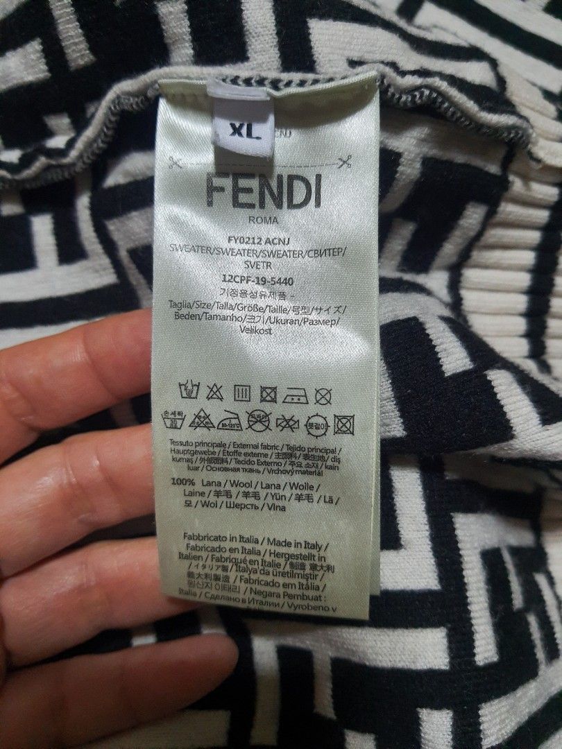 Fendi Monogram Sweater (Category: Luxury Apparel) located in Cebu City. Submitted by branded11 (Listing ID 1400540714, Image 3). Description: - Fendi sweater - Black and white repeating monogram pattern - Crew neck - Long sleeves with striped cuffs - Striped detail on the side - Fendi logo on collar.