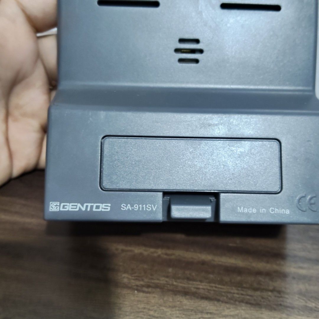 Gentos SA-911SV Digital Clock (Category: Clocks) located in Catbalogan. Submitted by jpnsrpls (Listing ID 1400418029, Image 3). Description: - Gentos SA-911SV Digital Clock - Displays time, date, and alarm - Features a sleek silver frame - Easy-to-read digital display - Front buttons for time and alarm settings - Brand and model details on the back - Made in China.