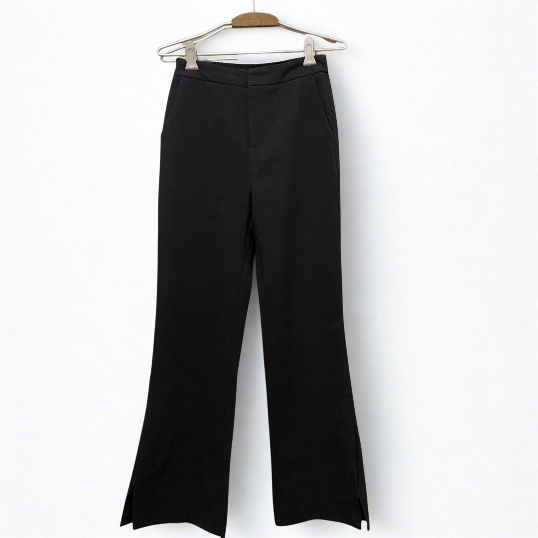 High Rise Wide Leg Flare Trouser (Category: Other Bottoms) located in Malabon City. Submitted by k_mby (Listing ID 1400541194, Image 1). Description: • waist 26-28 • length 40 • solid black • with slit both sides • 2 front pockets (no back pockets) • no issue.