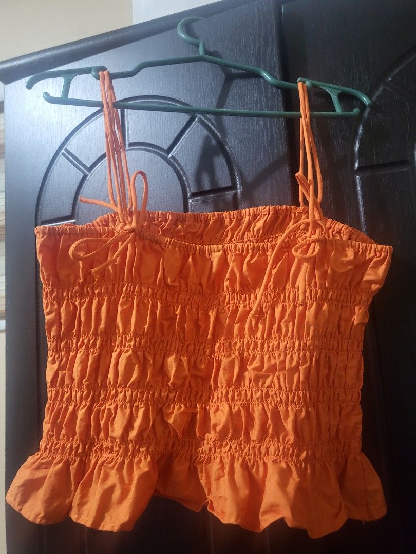 H&M Orange Smocked Ribbon Tie Top (Category: Sleeveless) located in Manila. Submitted by miyoungg (Listing ID 1400513834, Image 3). Description: Never worn, only washed. RFS: Decluttering, too much clothes na :(.