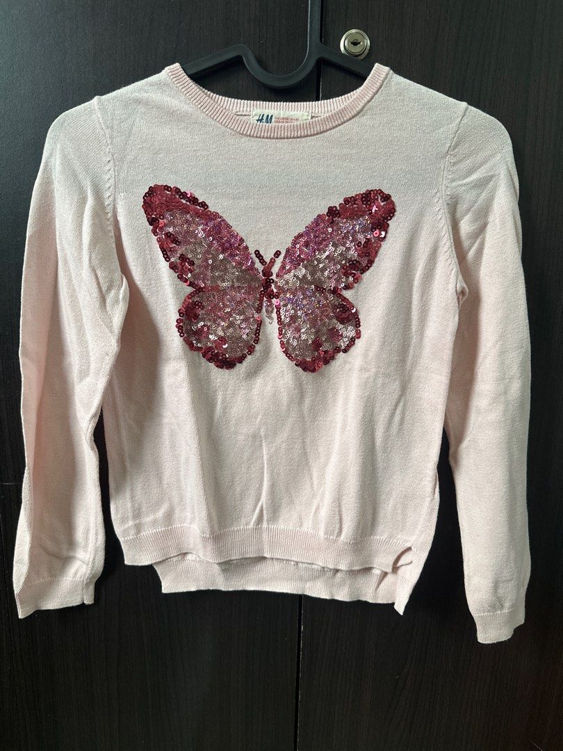Kids H&M Pink Butterfly Sequin Sweater (Category: Babies & Kids Fashion) located in San Pedro. Submitted by Graceleen (Listing ID 1400406465, Image 1). Description: - H&M pink sweater - Features a sequined butterfly design - Long sleeves and round neckline - Size: EUR 122/128, US 6-8Y, CA 6-8A, CN 130/64, AUS 7-8 Used only for 3-4 times, still in mint condition..