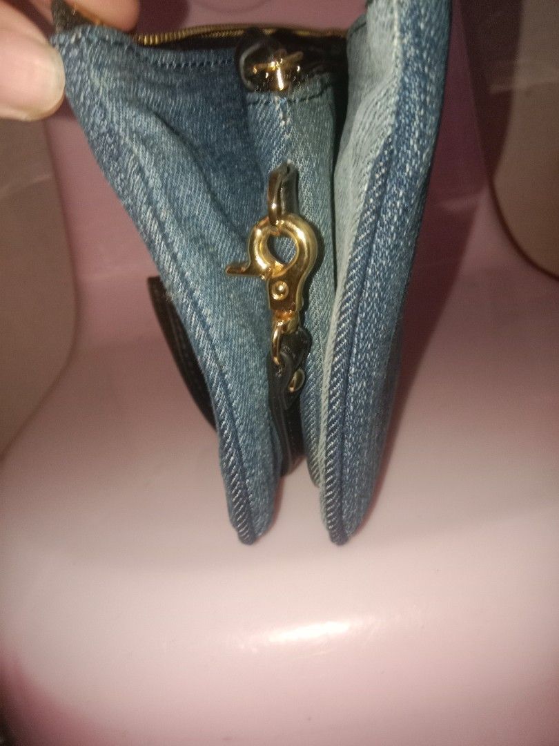 Miss Sixty Denim Wallet (Category: Wallets & Card holders) located in Bulacan. Submitted by chubbylicious (Listing ID 1400431121, Image 2). Description: Listing includes two wallets. One is a denim wallet with the brand name "Miss Sixty" on the front. It has a wrist strap and multiple compartments inside. The other wallet has a colorful floral and bird design. It has a zipper closure and multiple card slots..
