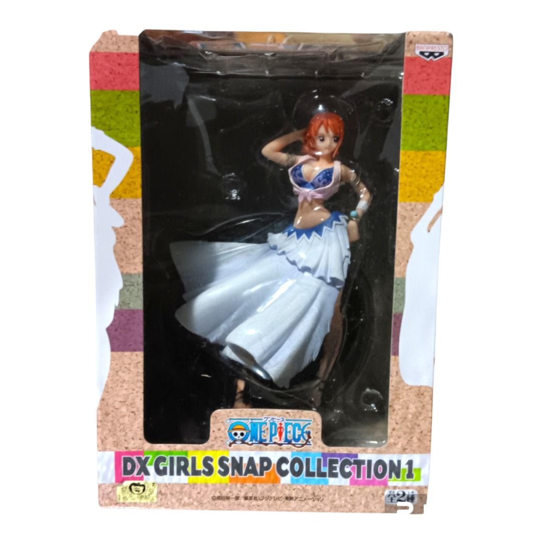 One Piece DX Girls Snap Collection 1 Nami Figure (Category: Figurines & Statues) located in Manila. Submitted by babykram1477407 (Listing ID 1400583473, Image 1). Description: - Nami figure from the One Piece DX Girls Snap Collection 1. - Brand new, unopened in original packaging. - Features Nami in a white dress and blue top. - Includes the original box with the One Piece logo and collection name. - Manufactured by Banpresto..