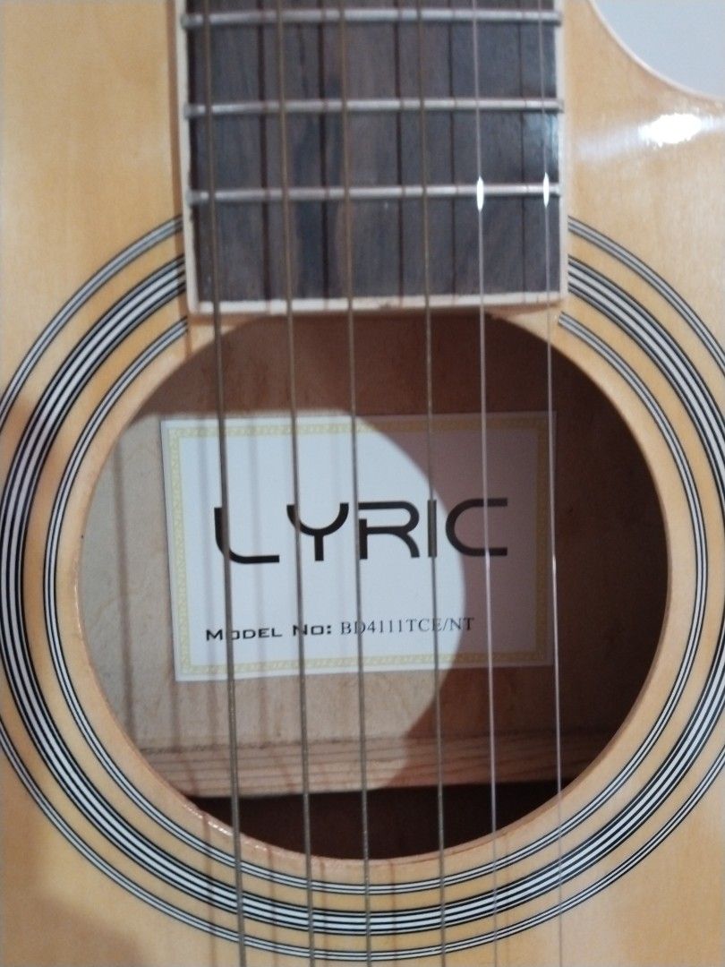 MUST GO! Electric/acoustic guitar (Category: Musical Instruments) located in Paranaque City. Submitted by earth_tiger29 (Listing ID 1400396997, Image 3). Description: ⚠️RUSH SALE 💯Lyric electric/acoustic guitar 🥺sinubukang mag aral pero hindi talaga ako pang strings kaya ibebenta na lang ✅with FREE bag ✅ discount to sure buyer 📱DM for details 🏍Delivery only (sf c/o buyer) 📍General Trias Cavite.