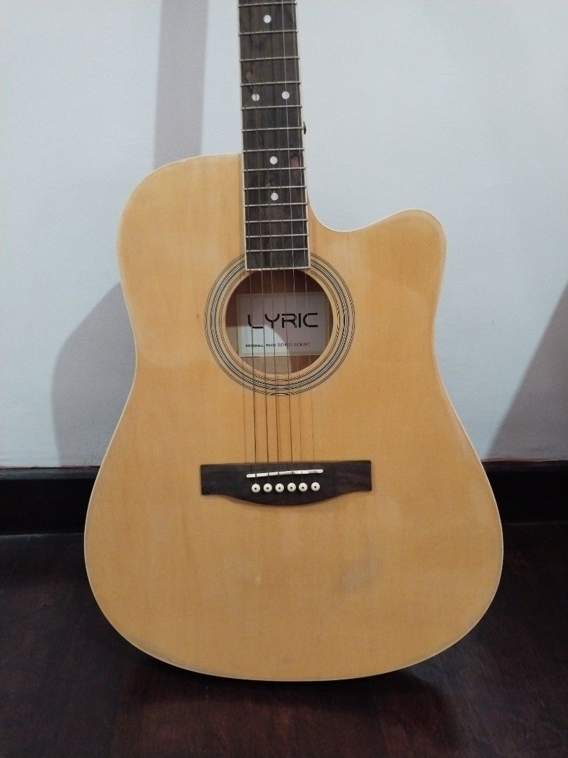 MUST GO! Electric/acoustic guitar (Category: Musical Instruments) located in Paranaque City. Submitted by earth_tiger29 (Listing ID 1400396997, Image 2). Description: ⚠️RUSH SALE 💯Lyric electric/acoustic guitar 🥺sinubukang mag aral pero hindi talaga ako pang strings kaya ibebenta na lang ✅with FREE bag ✅ discount to sure buyer 📱DM for details 🏍Delivery only (sf c/o buyer) 📍General Trias Cavite.