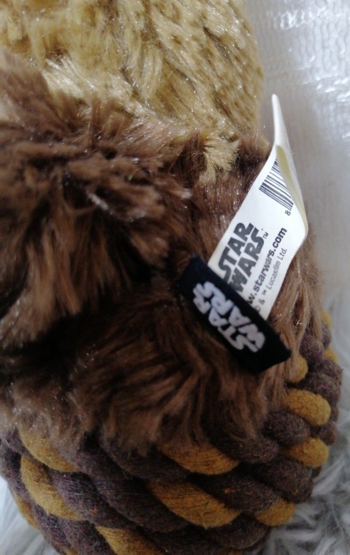 Star Wars Chewbacca Plush Toy (Category: Plushies & Soft Toys) located in La Trinidad. Submitted by saped87 (Listing ID 1400417256, Image 2). Description: - Adorable Chewbacca plush toy - Detailed design with brown fur - Woven bottom - Includes Star Wars logo tag - Great collectible for Star Wars fans.
