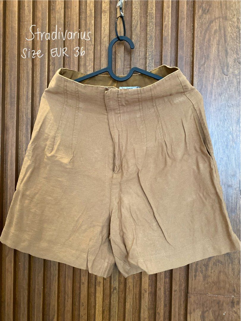 Stradivarius Brown Shorts EUR 36 (Category: Shorts) located in Makati City. Submitted by mcquindara (Listing ID 1400470112, Image 1). Description: - Stradivarius brown shorts - High-waisted style - Button and zipper closure - Includes side pockets - Size: EUR 36.