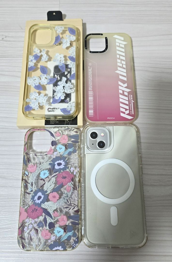 [USED] iPhone 13 Cases (bundle of 4) (Category: Cases & Sleeves) located in Pasig City. Submitted by findingviolet (Listing ID 1400529774, Image 2). Description: [USED] iPhone 13 cases Condition: Used *Bundle includes of 4 cases for iPhone 13 (take all): 1. Cyrill by Spigen - floral design 2. Rock Space 3. MVMT Magsafe - floral design 4. MVMT Clear Magsafe RFS: decluttering Shipping and Fees c/o Buyer Mode of Payment: GCash / Maya / BPI Bank Tran