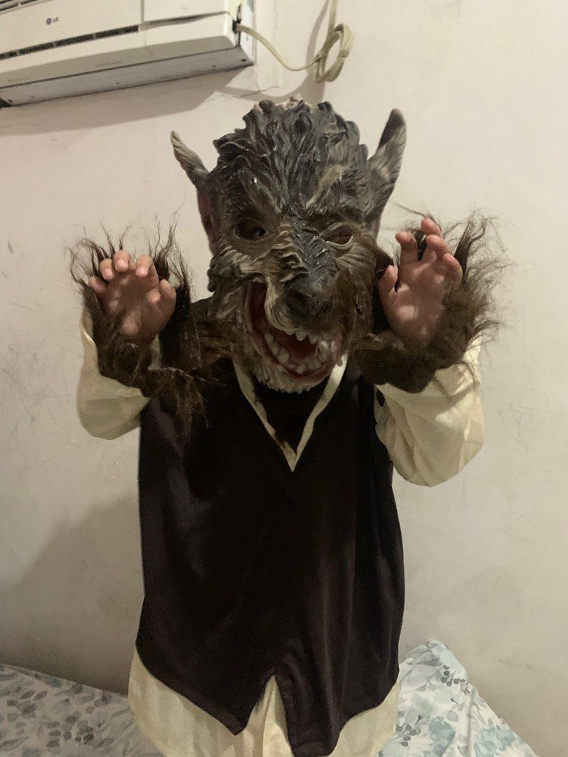 Werewolf Mask and Costume (Category: Babies & Kids Fashion) located in Angeles City. Submitted by danedane06 (Listing ID 1400581371, Image 2). Description: - Includes a realistic werewolf mask with detailed fur and teeth. - Features a dark brown tunic with cream-colored sleeves. - Ideal for Halloween or costume parties. - Can fit 5-16 years old -bought from Canada, not ukay Issue: mask has a tear at the back.