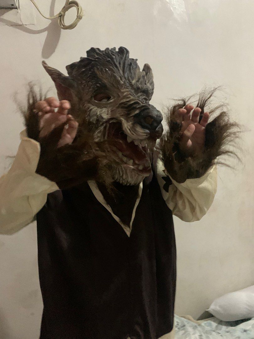 Werewolf Mask and Costume (Category: Babies & Kids Fashion) located in Angeles City. Submitted by danedane06 (Listing ID 1400581371, Image 1). Description: - Includes a realistic werewolf mask with detailed fur and teeth. - Features a dark brown tunic with cream-colored sleeves. - Ideal for Halloween or costume parties. - Can fit 5-16 years old -bought from Canada, not ukay Issue: mask has a tear at the back.
