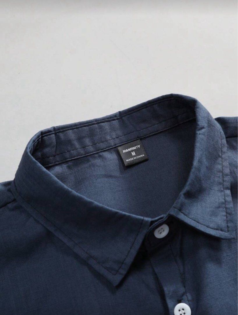 2pcs Manfinity Short Sleeve Shirt - Navy Blue (Category: Tshirts & Polo Shirts ) located in Antipolo. Submitted by mmbariate (Listing ID 1400590181, Image 3). Description: - Manfinity navy blue short sleeve shirt - Size: S - Features: - Button-down front - Chest pocket - Classic collar - Color: Navy blue - Made in China.