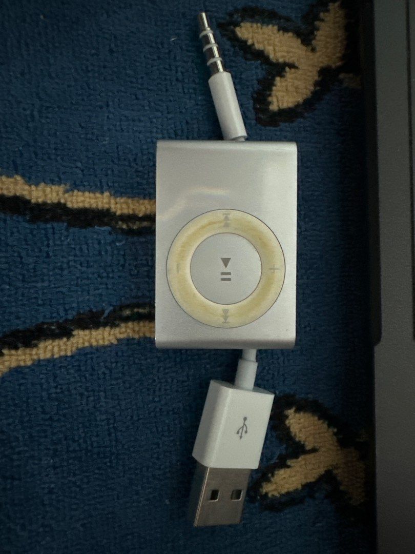 Apple iPod Shuffle (Category: Portable Music Players) located in Manila. Submitted by thingyfinder (Listing ID 1400612509, Image 2). Description: Broken batt, not charging. For parts. - Apple iPod Shuffle - Includes USB cable - Silver color - Click wheel for easy navigation - 3.5mm audio jack - Compact and portable music player.