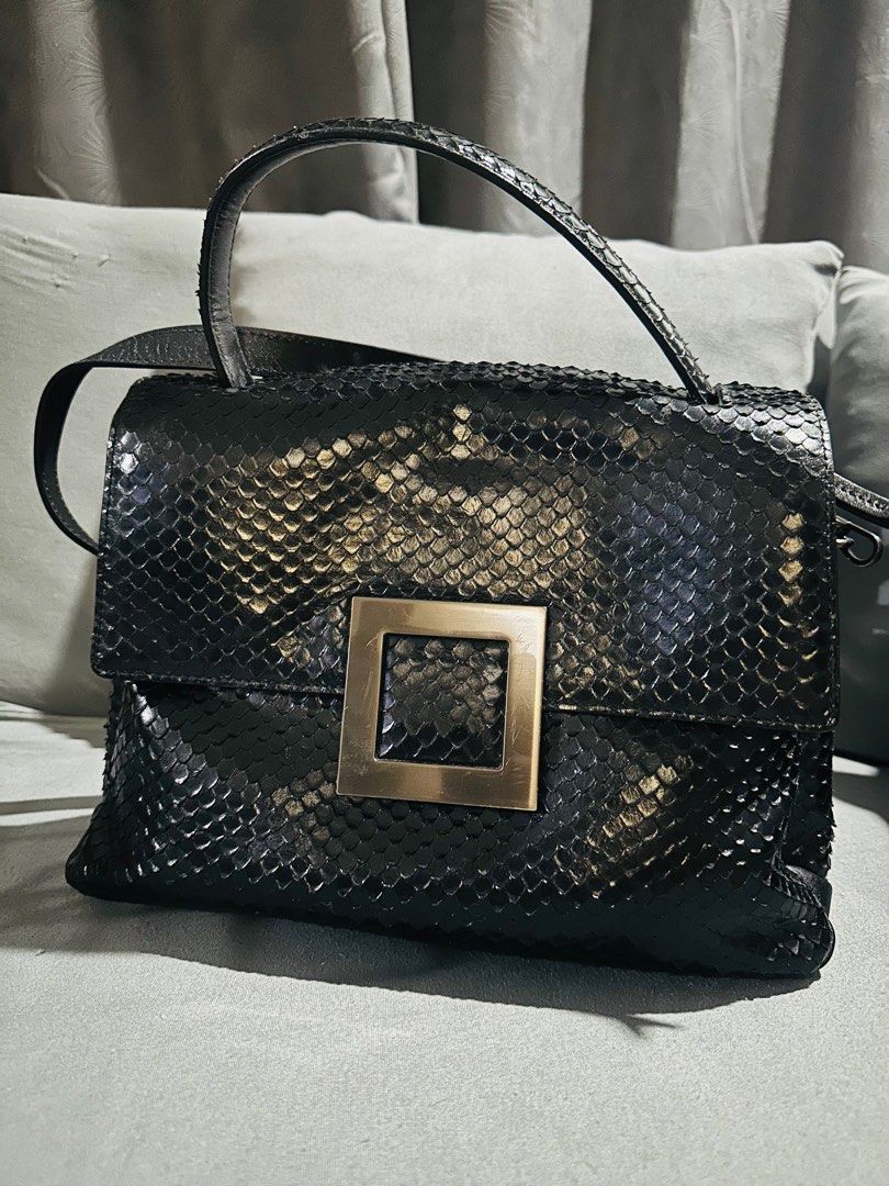 Rouge and Lounge bag original (Category: Luxury Bags & Wallets) located in Makati City. Submitted by pusturah (Listing ID 1400769608, Image 1). Description: - Black handbag with snakeskin texture - Gold square buckle detail - Includes top handle and shoulder strap - Made of leather.