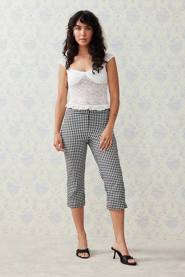 BNWT Urban Outfitters Gingham Capri Pants XS (Category: Other Bottoms) located in Davao. Submitted by quickootd (Listing ID 1400771270, Image 2). Description: Stylish capri pants from Urban Outfitters. Features a classic black and white gingham pattern. The pants have a fitted silhouette and a cropped length, perfect for warmer weather. They have a button closure and a small slit at the hem. Size XS. bought in europe.