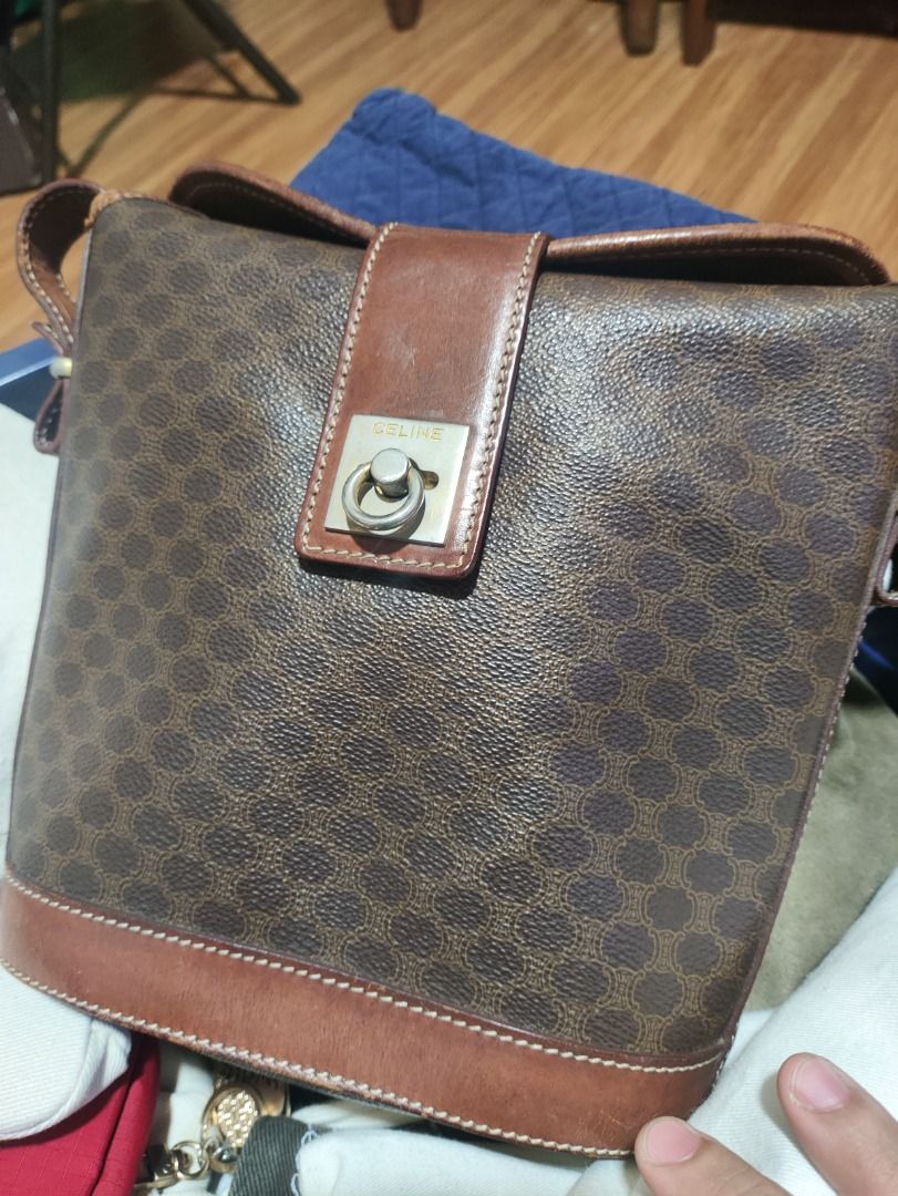 Celine Macadam Bucket Bag (Category: Luxury Bags & Wallets) located in Caloocan City. Submitted by mjoymiran43692 (Listing ID 1400690859, Image 1). Description: - Authentic Celine bucket bag - Iconic Macadam pattern - Brown leather trim - Top flap closure with metal ring detail - Shoulder strap - Classic and stylish design - Perfect for everyday use.
