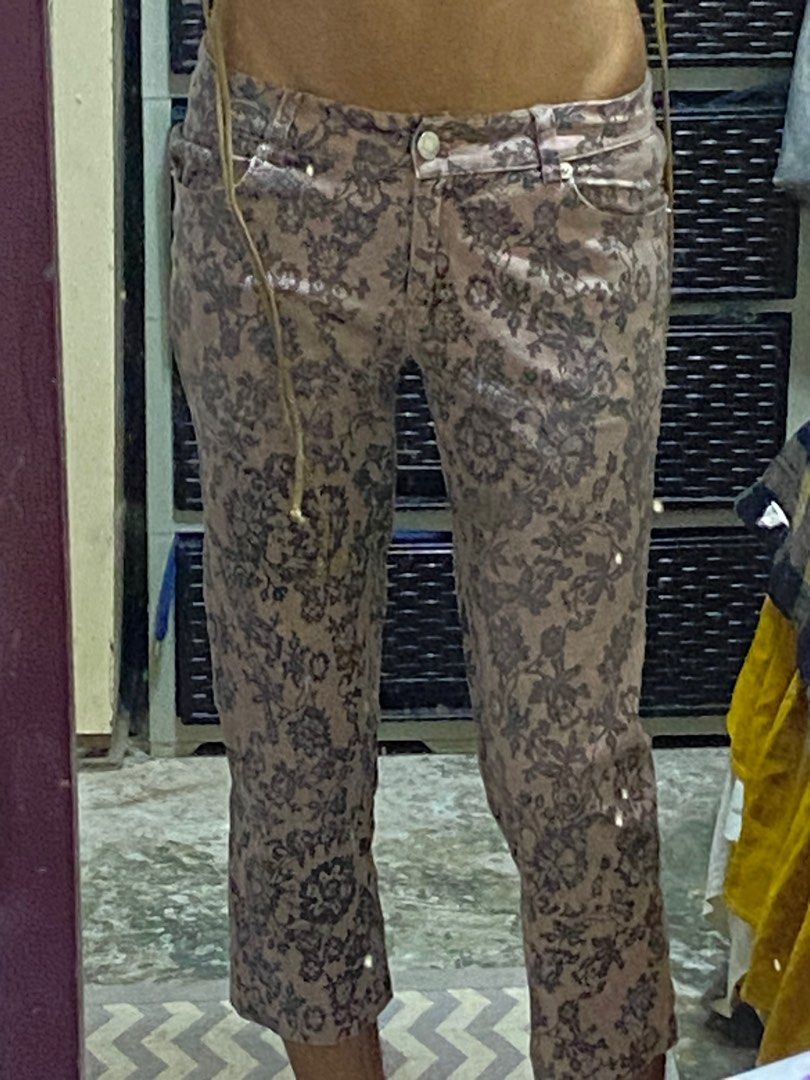 Christian Dior Floral Print Pants (Category: Luxury Apparel) located in Liloan. Submitted by iwynirock (Listing ID 1400650459, Image 3). Description: - Authentic Christian Dior pants - Stunning floral print - Size 38 - Cropped length - Beige and gray fabric blend - Features Dior logo button closure.