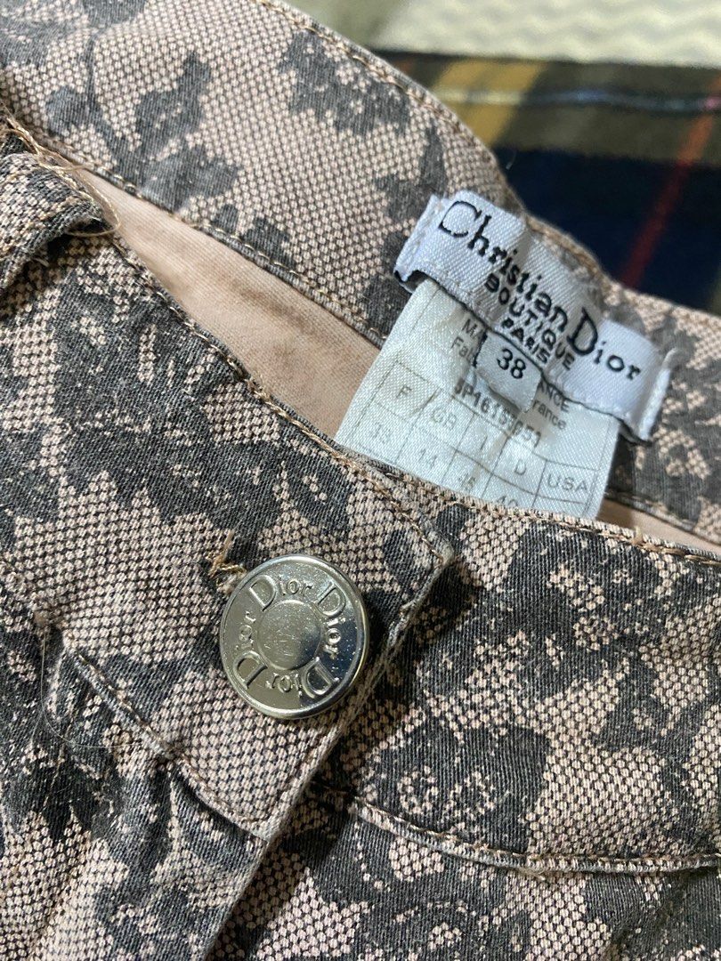 Christian Dior Floral Print Pants (Category: Luxury Apparel) located in Liloan. Submitted by iwynirock (Listing ID 1400650459, Image 2). Description: - Authentic Christian Dior pants - Stunning floral print - Size 38 - Cropped length - Beige and gray fabric blend - Features Dior logo button closure.