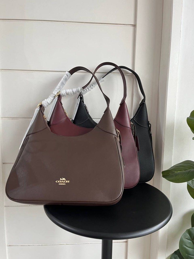 Coach Ella New Collection (Category: Luxury Bags & Wallets) located in Batangas. Submitted by YSABELLE_MARGARETTE (Listing ID 1400637982, Image 2). Description: - Brand new Coach shoulder bag - Available colors: Black, Brown, Burgundy - Sleek design with single shoulder strap - Secure zip closure - Spacious interior - Includes signature Coach hangtag - Perfect for everyday or special occasions.