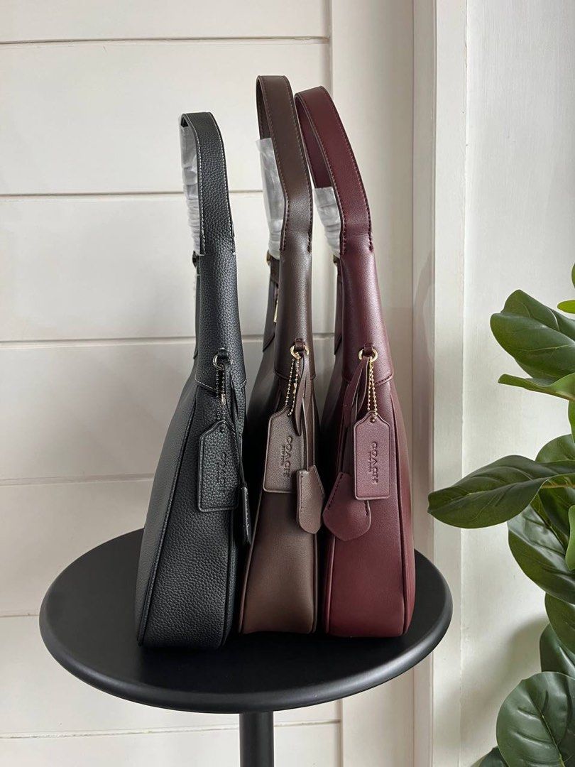 Coach Ella New Collection (Category: Luxury Bags & Wallets) located in Batangas. Submitted by YSABELLE_MARGARETTE (Listing ID 1400637982, Image 3). Description: - Brand new Coach shoulder bag - Available colors: Black, Brown, Burgundy - Sleek design with single shoulder strap - Secure zip closure - Spacious interior - Includes signature Coach hangtag - Perfect for everyday or special occasions.