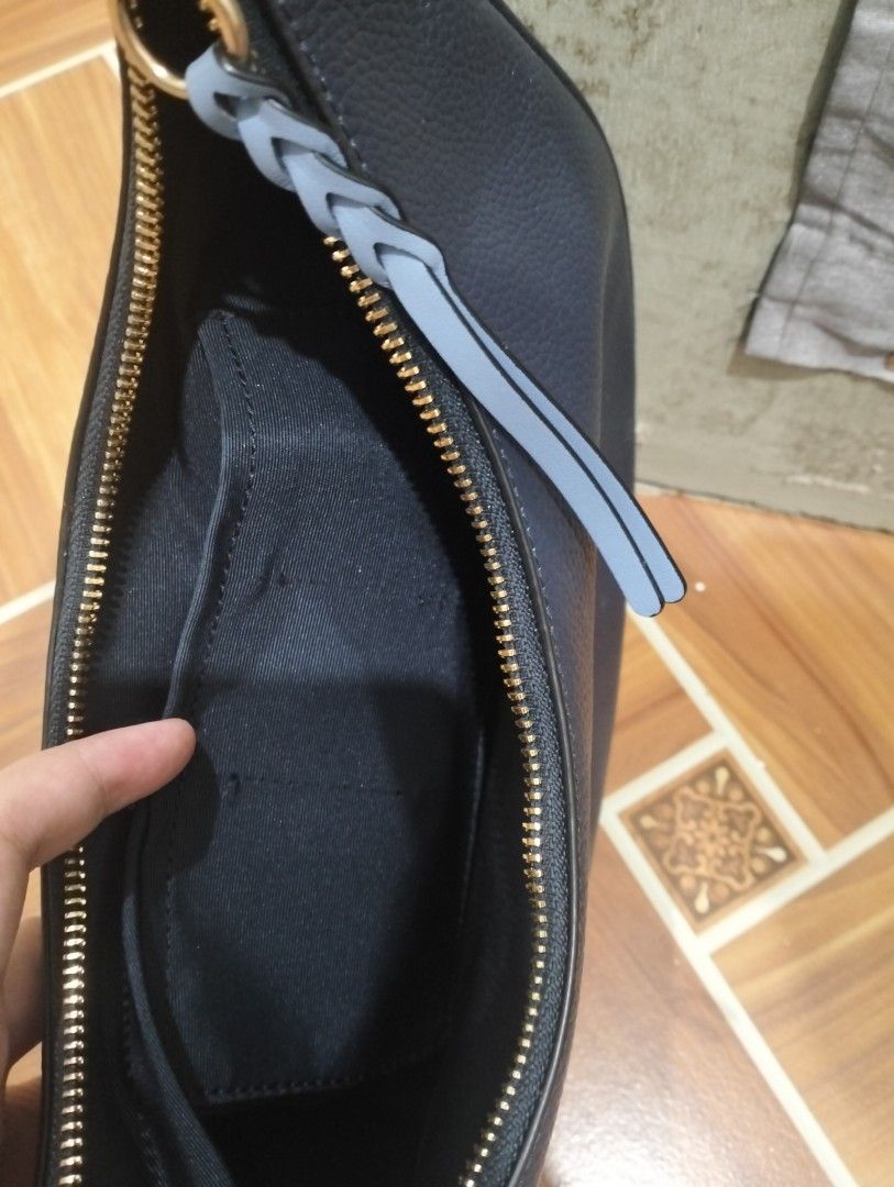 UNTAG - Coach Navy Blue Crescent Shoulder Bag (Category: Luxury Bags & Wallets) located in Manila. Submitted by mysticdolphin-fd4a (Listing ID 1400603682, Image 3). Description: Note: This is an UNTAG Original Couch Bag. SALE!SALE! Need to declutter na po! LAST PRICE!! - 700 - Original price - 1800 - From Cambodia - Navy Blue Coach shoulder bag - Crescent shape - Braided handle - Gold-tone hardware - Includes leather tag - Interior pocket - Zip c