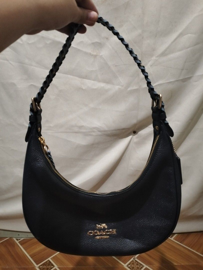 UNTAG - Coach Navy Blue Crescent Shoulder Bag (Category: Luxury Bags & Wallets) located in Manila. Submitted by mysticdolphin-fd4a (Listing ID 1400603682, Image 1). Description: Note: This is an UNTAG Original Couch Bag. SALE!SALE! Need to declutter na po! LAST PRICE!! - 700 - Original price - 1800 - From Cambodia - Navy Blue Coach shoulder bag - Crescent shape - Braided handle - Gold-tone hardware - Includes leather tag - Interior pocket - Zip c