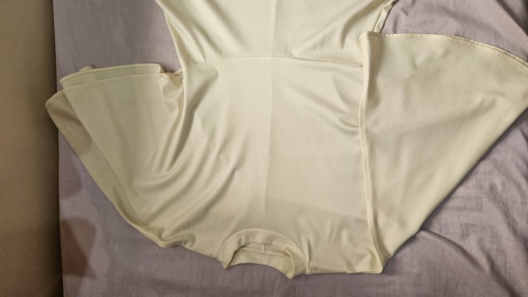 Cream-colored Turtleneck Bat's wing Dress (Category: Dresses) located in Davao. Submitted by bvxbmvn (Listing ID 1400678662, Image 2). Description: Cream-colored Turtleneck Bat's wing Formal Dress very stylish dress for formal events! the bat's wing design has 2 looped openings that shows the arms/shoulders the skirt is a flowy a-line small stains on the collar best fits medium frames all clothing items are washed before packing and sending thank
