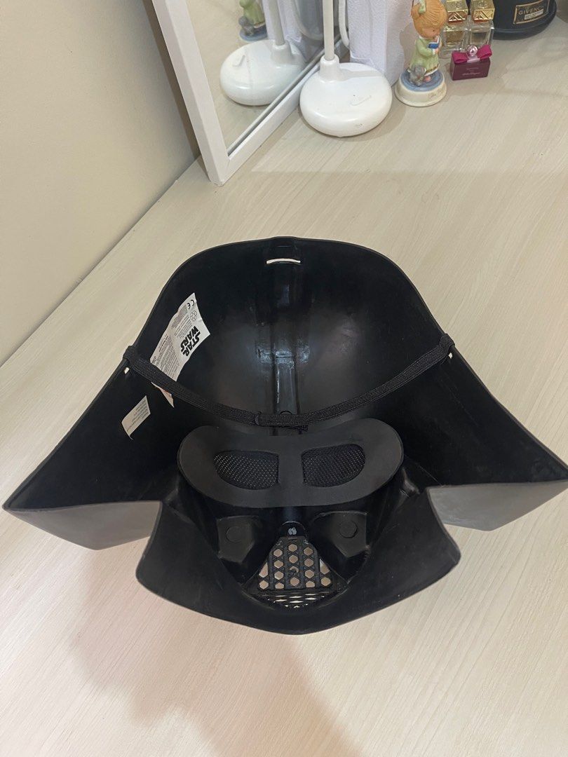 Darth Vader Mask STAR WARS Disney (Category: Western Merchandise) located in Makati City. Submitted by esila.essentials (Listing ID 1400774640, Image 3). Description: Darth Vader Mask STAR WARS Disney This rare and collectable Darth Vader mask is a must-have for any Star Wars fan. Made from durable plastic, this hard mask is perfect for display or cosplay. The mask features the iconic silhouette of the infamous Sith Lord, complete with breathing 